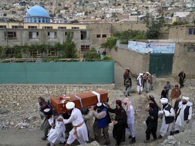 Police say the death toll in Afghan capital mosque bombing surpasses 20