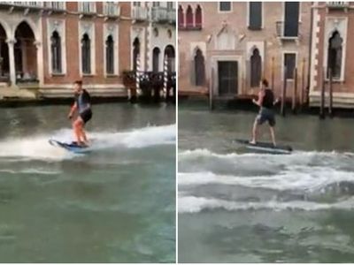 Venice mayor hits out at ‘idiot’ tourists for surfing along Grand Canal as two fined