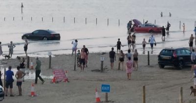 Pictures show moment cars were submerged by the rising tide on Weston beach