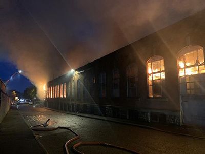 Two arrested over Oldham mill fire deaths