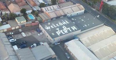 Prankster's naughty rooftop sign is scaring passengers landing at Sydney Airport