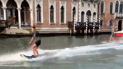 Venice mayor calls out 'imbeciles' surfing Italian city's historic canals