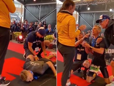 Ironman Triathlon athlete sparks debate after proposing to girlfriend while suffering severe leg cramps