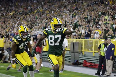 Best photos of Romeo Doubs’ acrobatic touchdown catch and Lambeau Leap