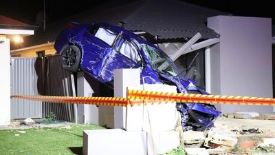 Car smashes into front of Piara Waters home, sends debris flying through wall, then stops atop fence