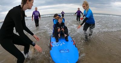 South Shields Surf School helps hospice youngsters to hit the waves with special chair board