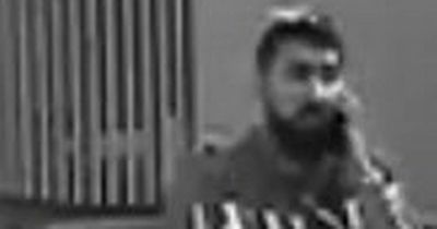 Police want to speak to this man after crime in Bolton town centre bank