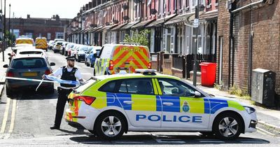 Woman found shot dead in back garden of house as police hunt car 'driven erratically'