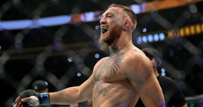 Conor McGregor mocks and laughs at UFC rival Kamaru Usman as he's brought to hospital after fight