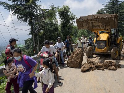 At least 40 people are dead after floods and landslides leave hit northern India
