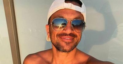 Peter Andre goes topless in snap as he spends summer break with kids Junior and Princess