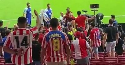 Atletico Madrid star held back from fight with own fans as police forced to intervene