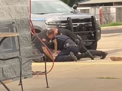 Three Arkansas police officers suspended after viral video shows them pounding man’s head into concrete