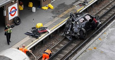 Woman dies as Range Rover plunges onto train track after horror car crash with Tesla