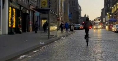 Reckless drivers seen pulling motorbike stunts on Edinburgh's Royal Mile
