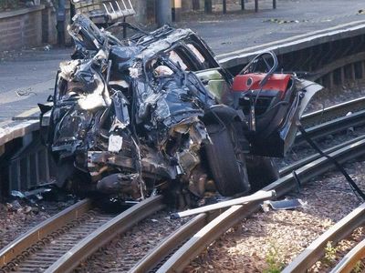 Woman dies in crash that leaves Range Rover on railway track