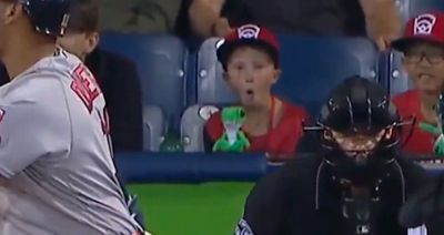 A Little Leaguer sitting behind home plate at Red Sox-Orioles had a great reaction to nasty pitch