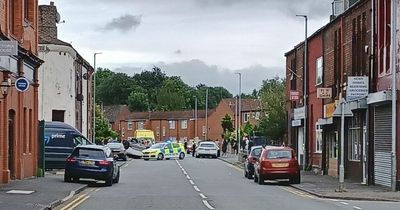 Drivers walk away unhurt as Vauxhall overturns in town centre