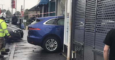 Car ploughs through pharmacy on Scots road as emergency services race to scene