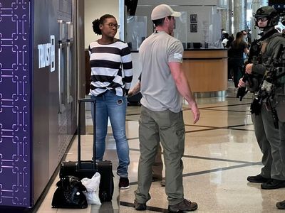 Pictured: Female suspect seized in Atlanta airport as two dead in shooting