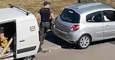 Video: Getaway driver moons at witnesses through car window as accomplice swipes tools from van
