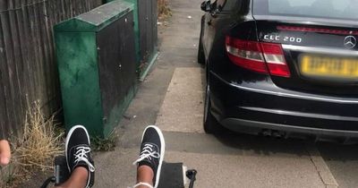 Driver's badly parked Mercedes forces mum to push son's wheelchair out onto road