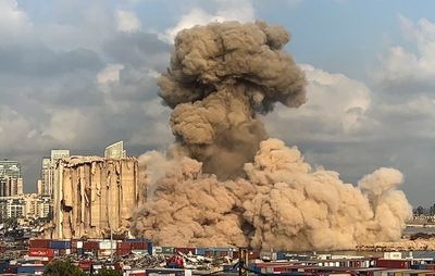 Large section of smoldering Beirut port silos collapses