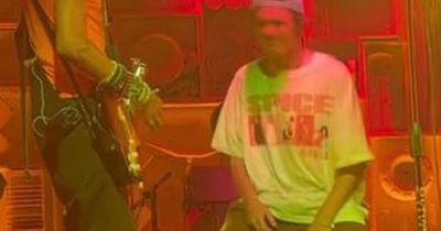 Cruz Beckham is mum Victoria's biggest fan as he wears Spice Girls top on stage