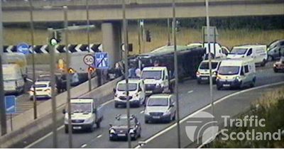 Edinburgh M8 drivers facing huge delays westbound as lorry crashes and overturns
