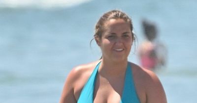 Jacqueline Jossa wows in plunging blue swimsuit and matching Crocs on Marbella beach day