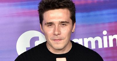 Brooklyn Beckham films himself making homemade pizza - but fans think it looks 'undercooked'