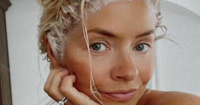 Holly Willoughby poses in towel as she insists she dyes her own hair at home