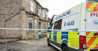 Police cordon put up around building with man taken to hospital