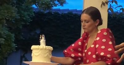 Wedding guests fume as woman cuts cake before bride and groom