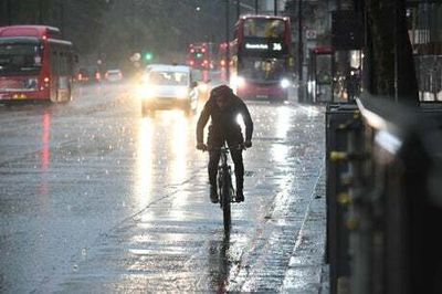 London weather: Flooding sparks commuter chaos as heavy rain closes Tube stations