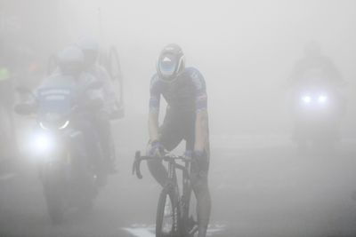 Rookie Evenepoel soars through fog into Vuelta lead