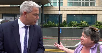 Angry woman confronts England Health Secretary Steve Barclay in street about ambulance delays