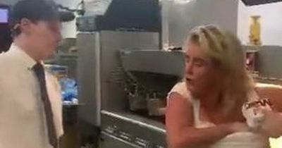 Woman storms McDonald's kitchen and crams Big Macs down her bra as staff try to stop her