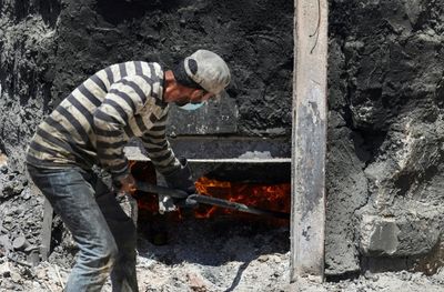 In risky recyling venture, Gazans burn plastic for fuel