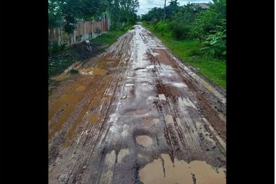 Village forced to rely on muddy, potholed road for decades