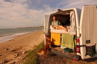 ‘Life is short’: Couple quit the rat race to travel Europe in a $7,000 campervan