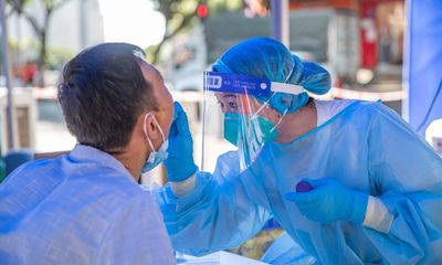 Chinese city’s residents made to queue for Covid tests in heat above 40C