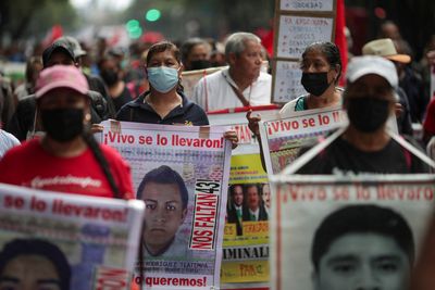 Parents of missing Mexican students see ex-official's arrest as step toward justice