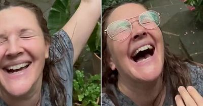 Drew Barrymore accused of racism for copying 'black men frolicking' trend with rain clip
