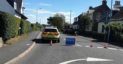 Man airlifted to hospital following crash between car and motorbike as Ayrshire road remains closed five hours later