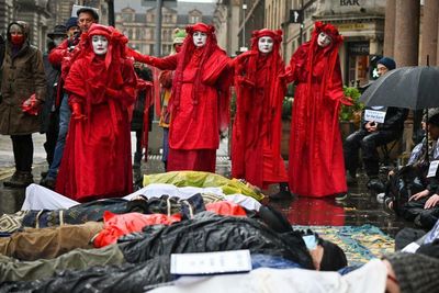 Climate protesters stage 'die-in' in Edinburgh after soaring temperatures in Scotland