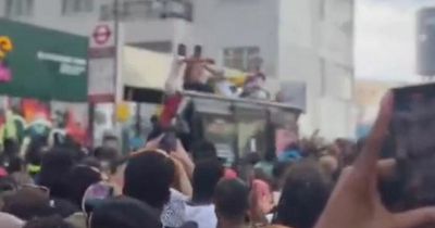 Notting Hill Carnival: Bus shelter collapses under dancing revellers as injuries reported