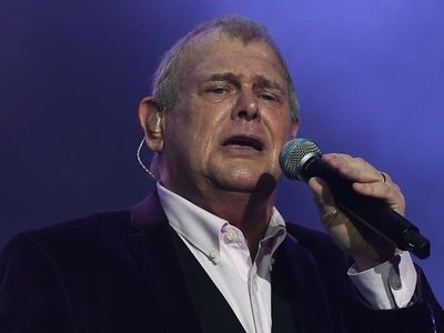 Farnham awake, stable in ICU after surgery