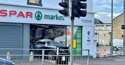 Car smashes into Ayrshire shop as police shut down street