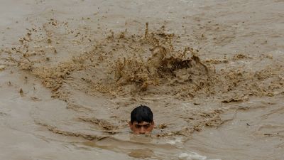 'Climate dystopia at our doorstep' as millions battle monsoon floods in Pakistan